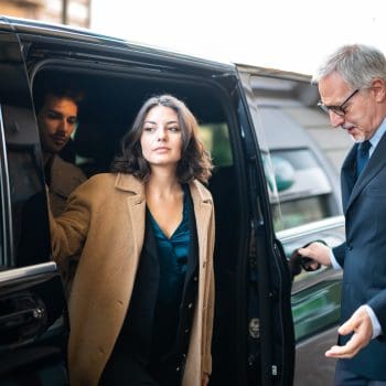 Passengers using a reliable shuttle transfer service with Eurotaxis, enjoying comfortable and convenient transport to their destination with professional drivers and spacious vehicles.